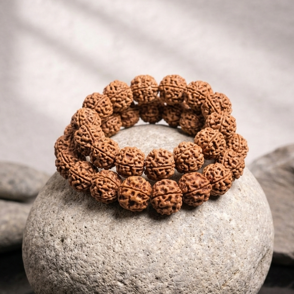 Brown textured 4 mukhi nepali rudraksha beads bracelet arranged in a loop enhancing spiritual meditation and astrology