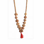 Load image into Gallery viewer, Rudrakesha mala necklace with large and small textured beads, natural brown tones, and a red tassel at the end.
